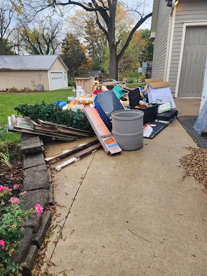 Dumpster being loaded with debris for 30 Yard Dumpster Rental in Glassboro